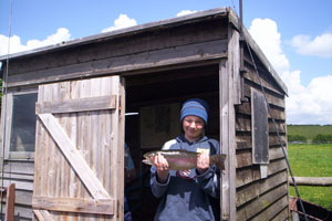 4 lb 6oz, a very nice fish. Not sure about the hat.