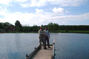 Two Level 2 coaches trying to look relaxed - 1 step back and they will be.